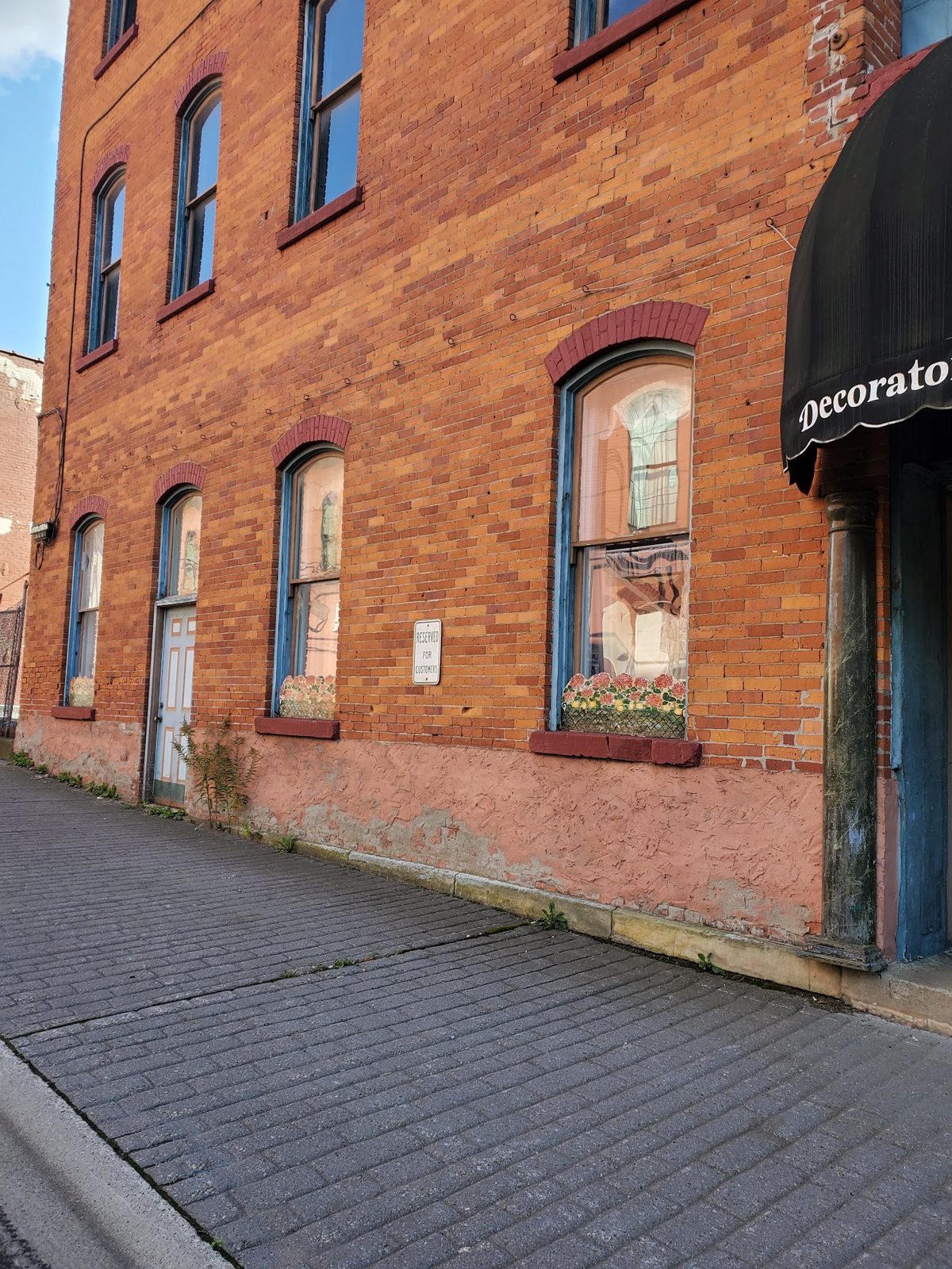 Street-level building elevation near the 116 East First St entrance