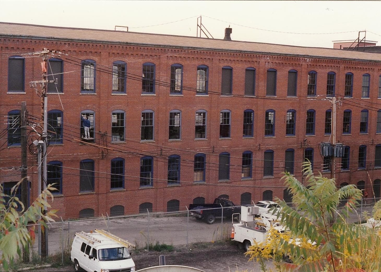 Four-story brick building, daylight exterior view