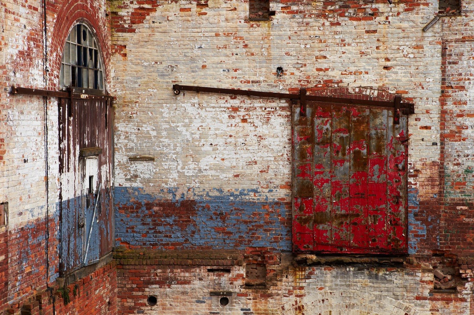 Weathered arched doorway and masonry detail
