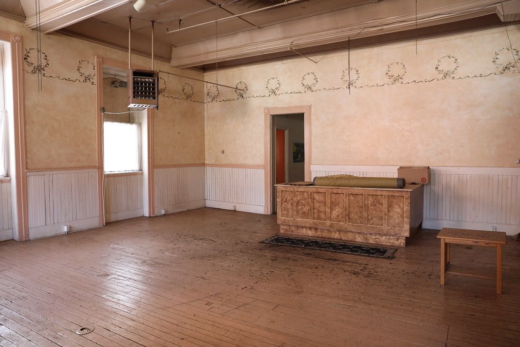 Top-floor room with original stenciled wall frieze