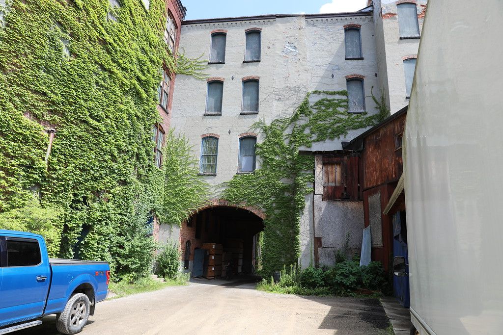 Ivy-covered archway leading into the building's interior courtyard