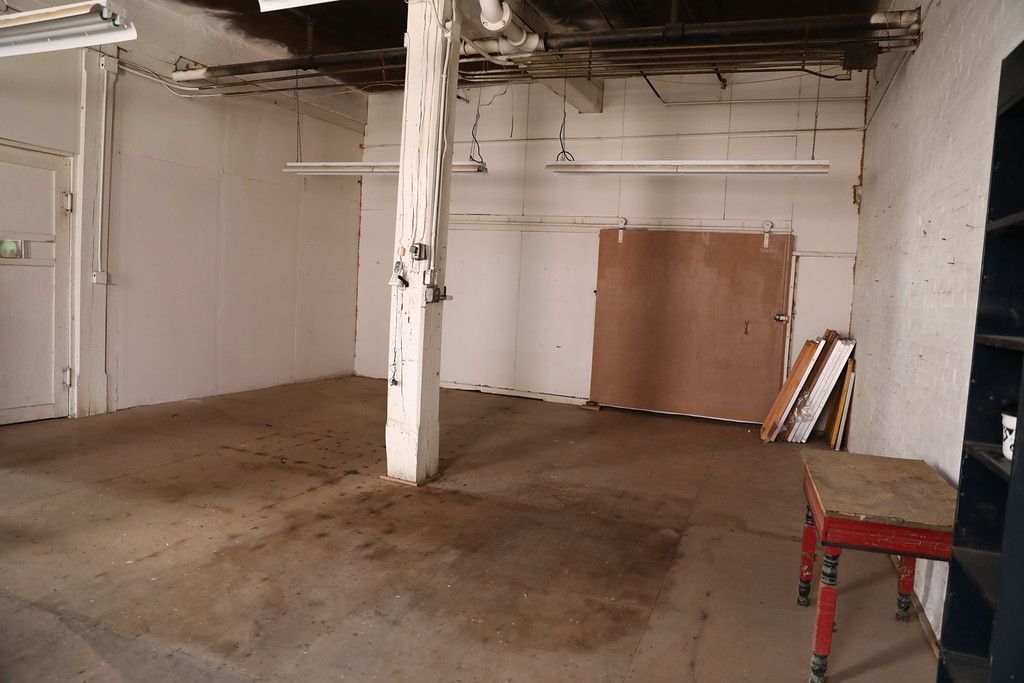 Unfinished room centered on a square timber post
